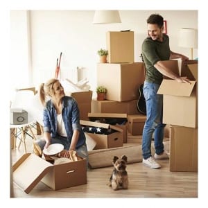 Couple unpacking with dog